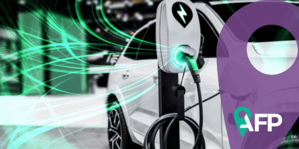 EV charging station for electric car in concept of green energy and eco travel. White car is charging at chargin station and green lights power the charging station. Purple graph and AFP logo sit on the right.