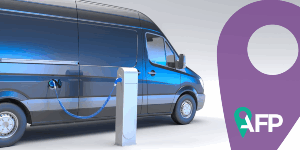 3D rendering of an electric van at a charging station.