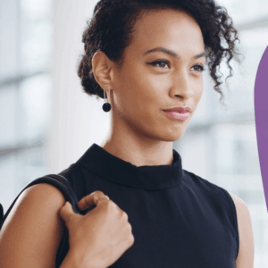 Woman looking confident walks while holding her bag