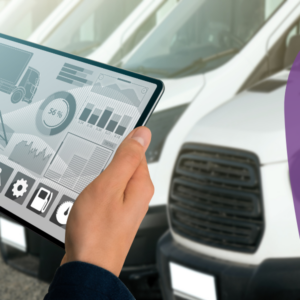 Fleet Mindset Course main image. Hands holding tablet with lots of graphs and stats. Background with white vans.